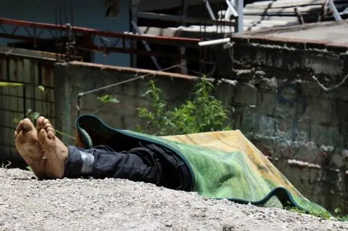Encuentran cuerpo con narcomensaje en San Jerónimo Caleras