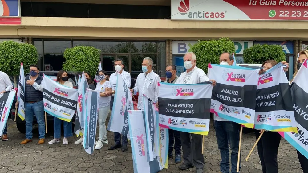 Con caravana, empresarios invitan a poblanos ir a votar